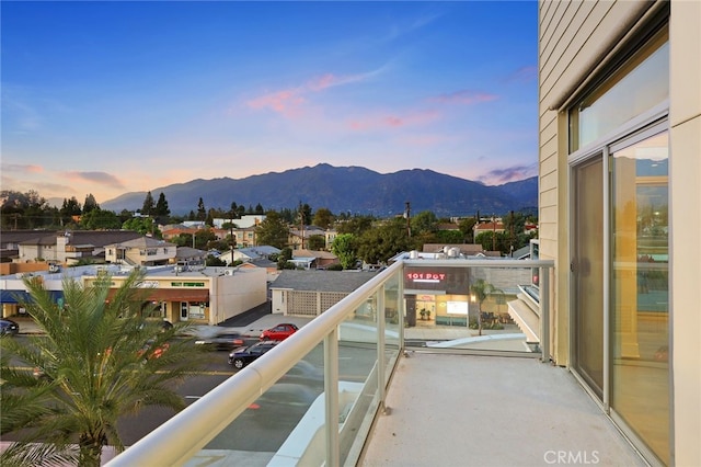 balcony at dusk with a mountain view