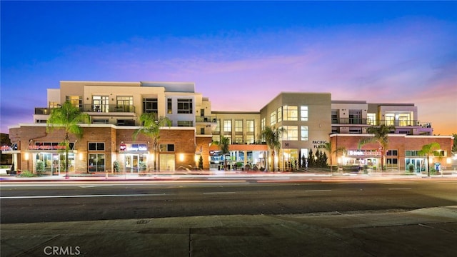 view of outdoor building at dusk