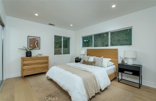 bedroom with light wood-type flooring