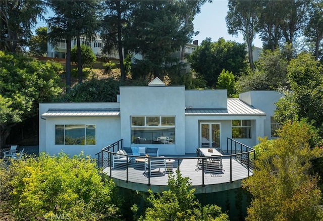 rear view of house featuring an outdoor hangout area and a deck