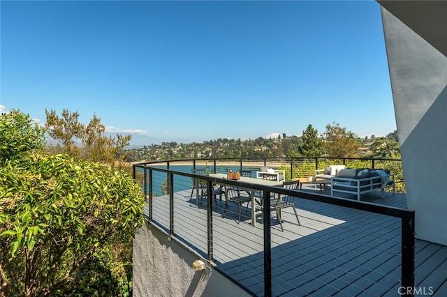 wooden deck featuring an outdoor hangout area