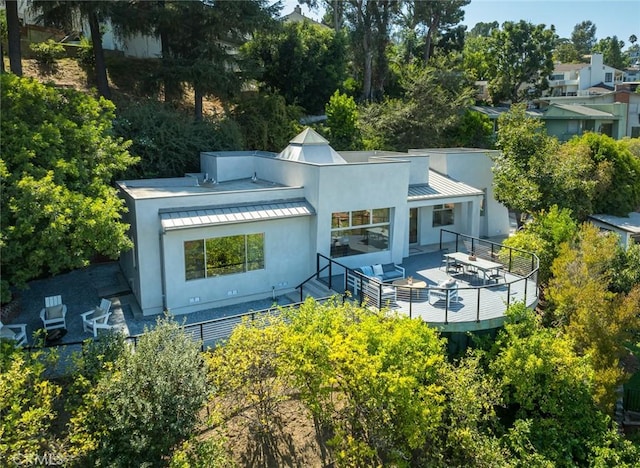 back of house featuring an outdoor hangout area