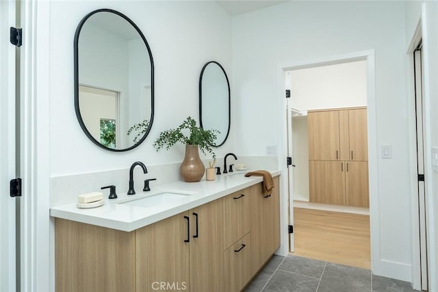 bathroom with vanity and hardwood / wood-style flooring