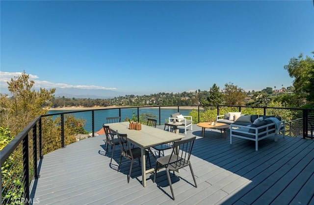 deck with a water view and an outdoor hangout area