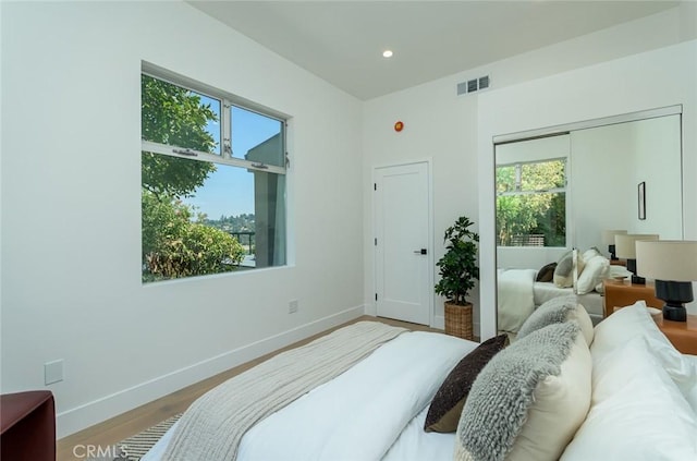 bedroom featuring a closet and hardwood / wood-style flooring