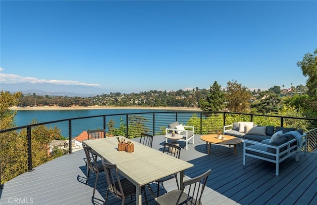 deck with a water view and an outdoor hangout area