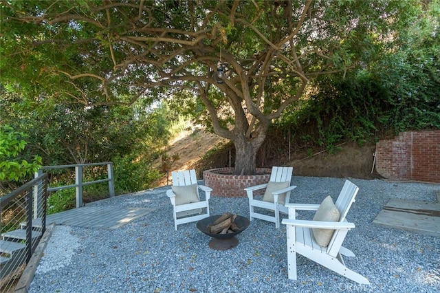 view of patio / terrace with an outdoor fire pit