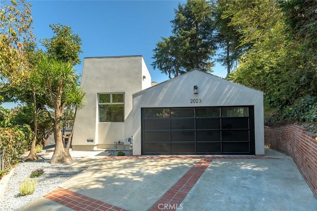 view of front of home featuring an outbuilding and a garage