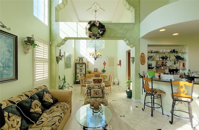 505 Lowe Dr, Placentia, CA 92870 - living room with a towering ceiling, a chandelier, and tile patterned flooring