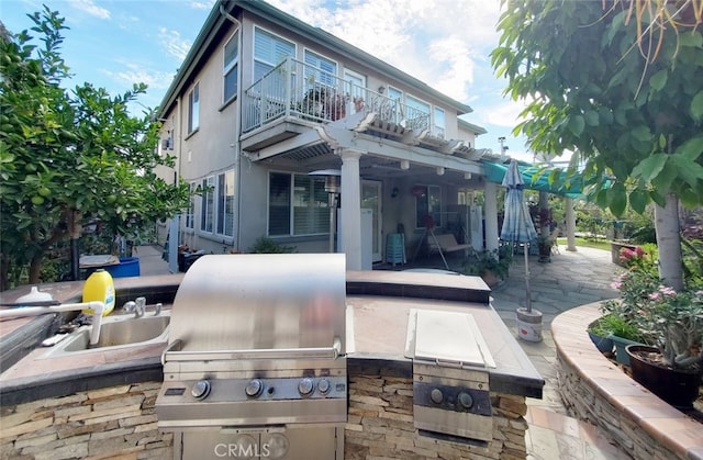 505 Lowe Dr, Placentia, CA 92870 - back of property with a balcony, a patio, and stucco siding