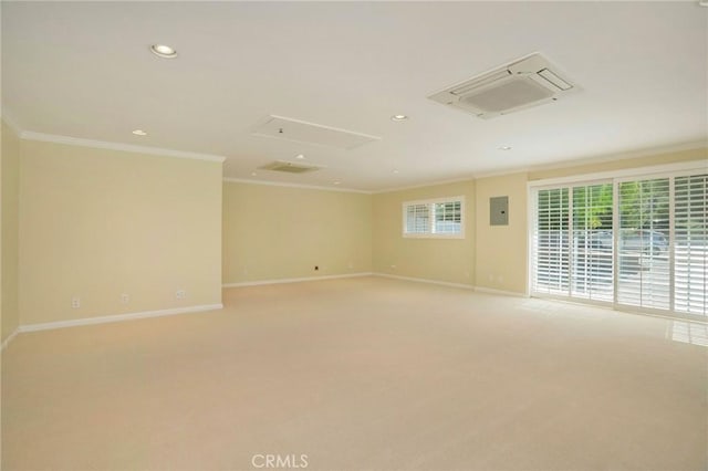 unfurnished room with baseboards, electric panel, recessed lighting, crown molding, and light colored carpet