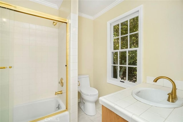 bathroom with vanity, tile patterned flooring, shower / washtub combination, crown molding, and toilet