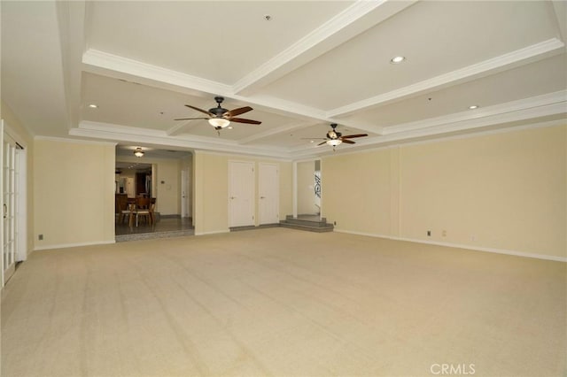 unfurnished living room featuring baseboards, coffered ceiling, beam ceiling, light carpet, and crown molding