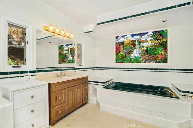 full bath featuring a garden tub, tile walls, and vanity