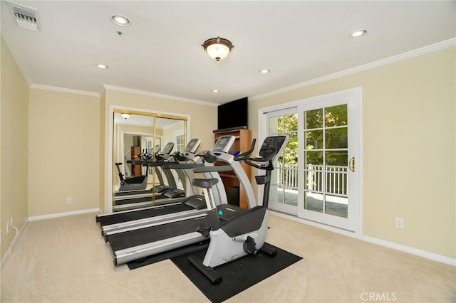 workout room with crown molding, carpet flooring, baseboards, and visible vents