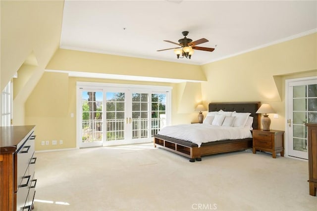 bedroom with access to exterior, french doors, and light colored carpet