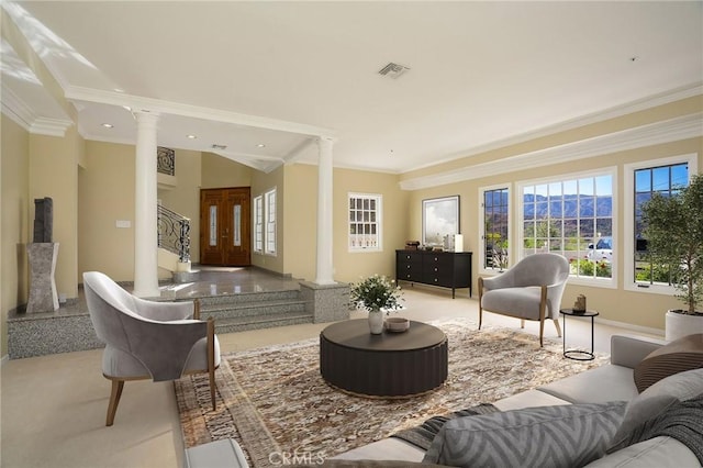 living area featuring visible vents, stairs, ornate columns, and ornamental molding