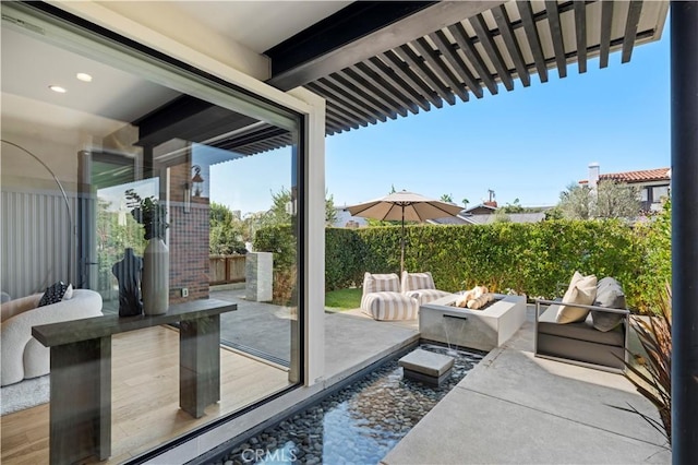 view of patio with a fire pit