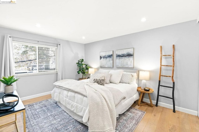 bedroom with light hardwood / wood-style floors