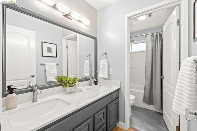 full bathroom with toilet, vanity, and shower / bath combination with curtain