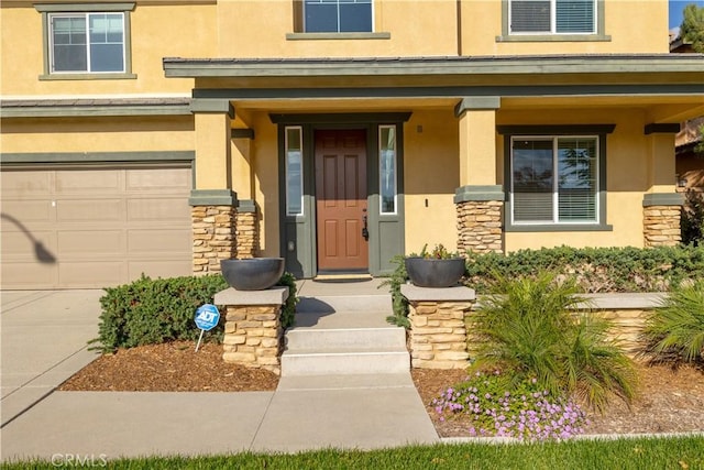 view of exterior entry featuring a garage