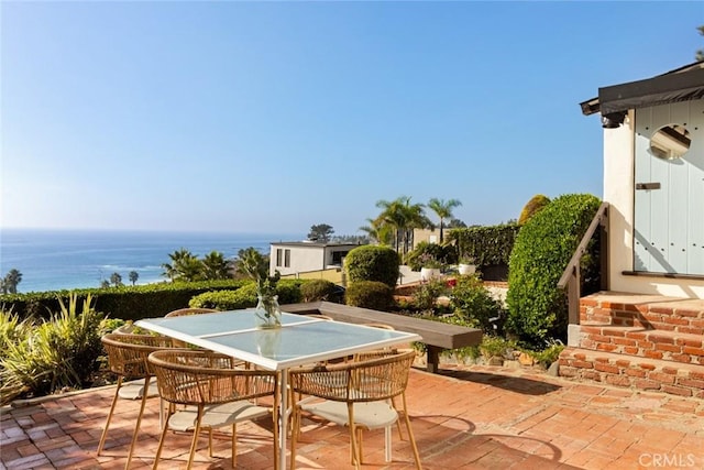 view of patio / terrace with a water view