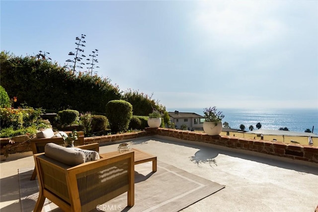 view of patio featuring a water view and an outdoor hangout area