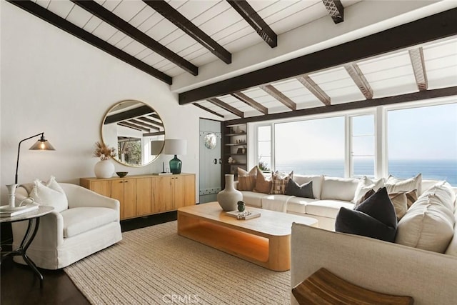 living room featuring vaulted ceiling with beams, a water view, and wood-type flooring