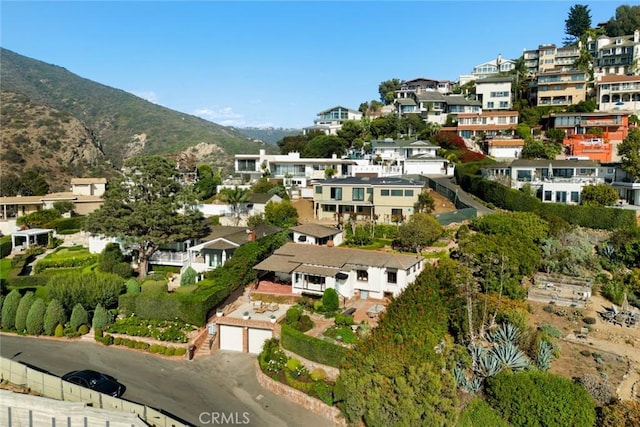 birds eye view of property featuring a mountain view