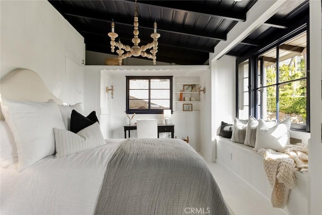 bedroom with lofted ceiling with beams and wooden ceiling