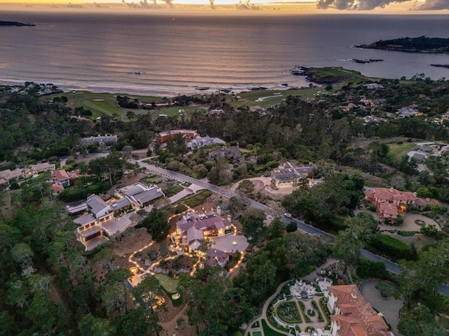 aerial view at dusk with a water view