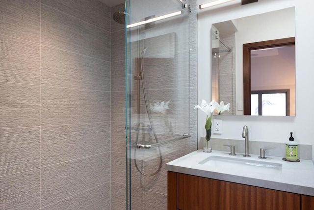 bathroom featuring vanity and an enclosed shower