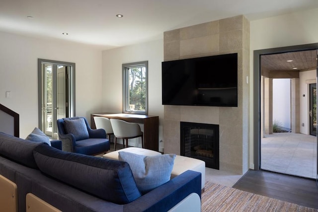 living room with hardwood / wood-style flooring and a fireplace