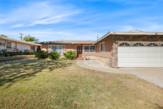 ranch-style house featuring a front yard and a garage