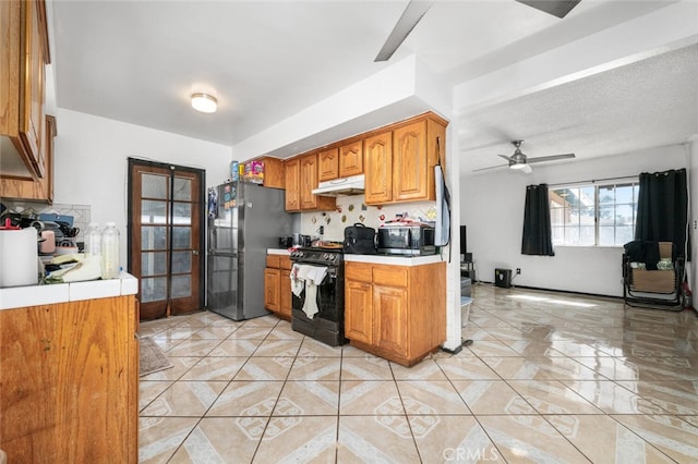 kitchen featuring appliances with stainless steel finishes and ceiling fan