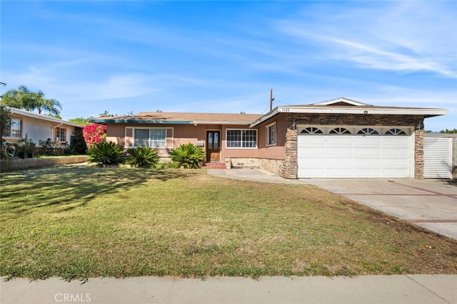 single story home featuring a front lawn and a garage