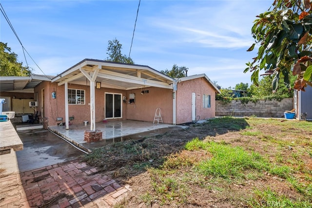 back of property featuring a patio area