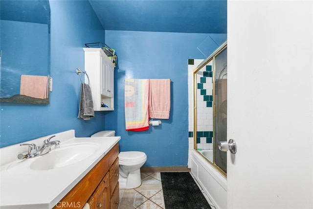 full bathroom with tile patterned flooring, vanity, toilet, and combined bath / shower with glass door