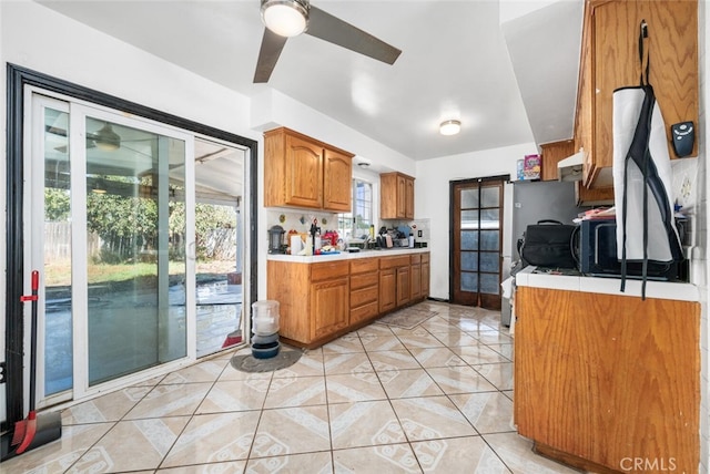 kitchen with ceiling fan and light tile patterned floors