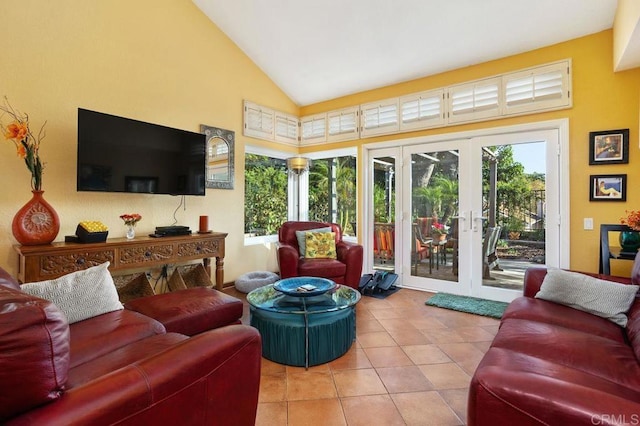 interior space featuring french doors and high vaulted ceiling