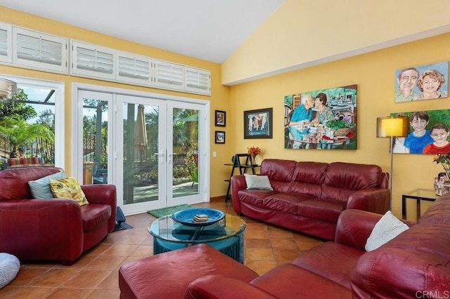 living room featuring tile patterned flooring, high vaulted ceiling, and french doors