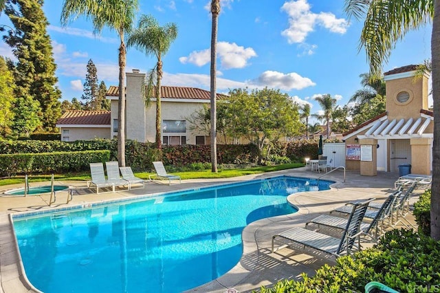 view of swimming pool with a patio area