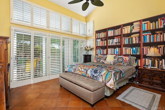 bedroom featuring tile patterned floors, access to exterior, ceiling fan, and high vaulted ceiling