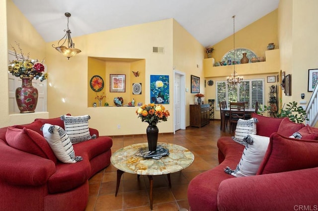 living room featuring high vaulted ceiling, an inviting chandelier, and tile patterned floors