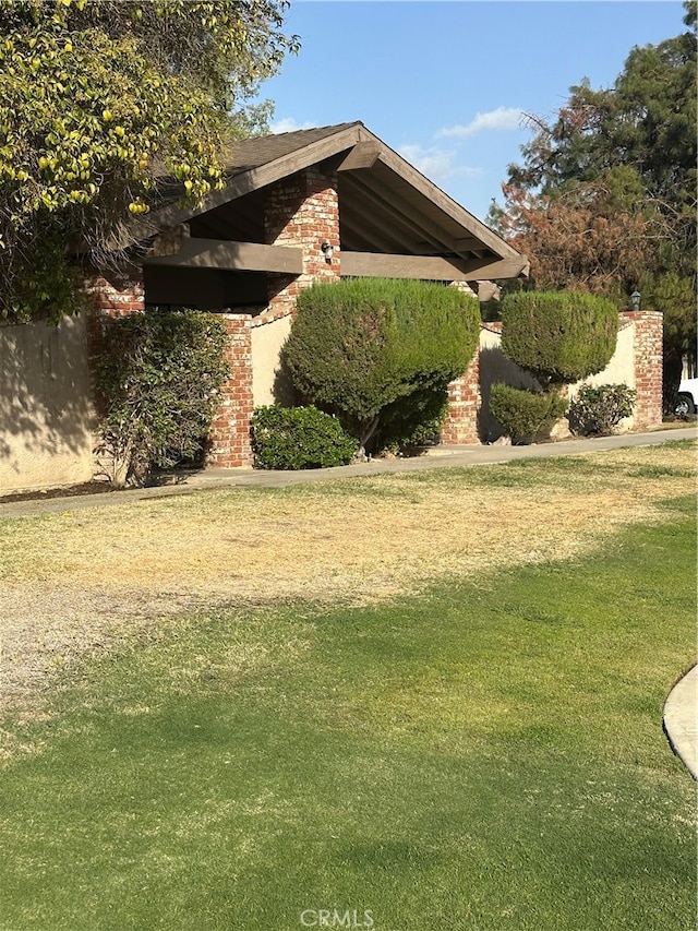 view of home's exterior featuring a lawn