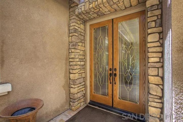 property entrance featuring french doors