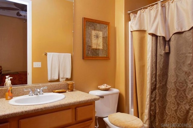 full bathroom featuring vanity, toilet, and shower / tub combo