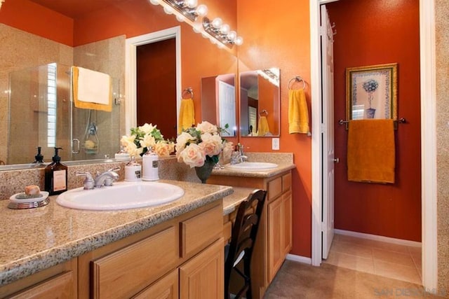 bathroom with vanity, tile patterned floors, and walk in shower