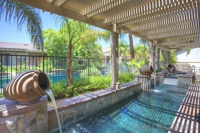 view of patio with pool water feature, a fenced in pool, and a pergola