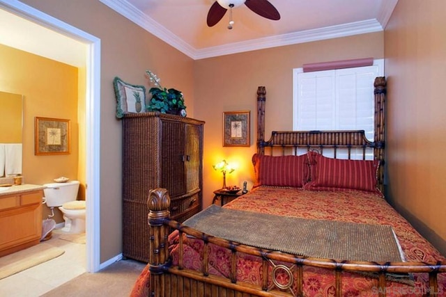 bedroom featuring crown molding, ensuite bathroom, light colored carpet, and ceiling fan